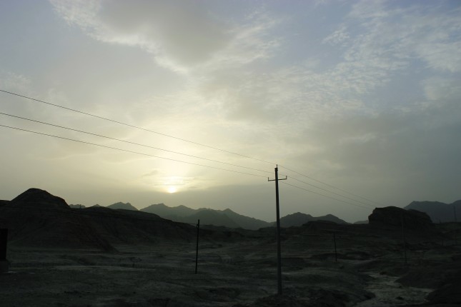 Coal mining station at Tianshan Mountains, Urumqi, 2016, courtesy of Meredith Peng A stretch of desert lined with telephone poles, 2016, courtesy of Meredith Peng A bird’s eye view of Urumqi, seen from the plane. Patches of green can be seen amidst vast plots of desert, 2016, courtesy of Meredith Peng