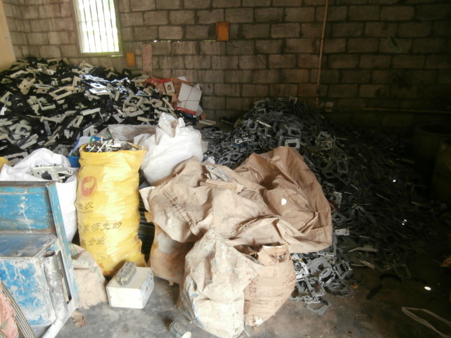 Dismantled and sorted CD cases for trading by weight, Guiyu, Guangdong (2013) Courtesy of Anna Lora-Wainwright