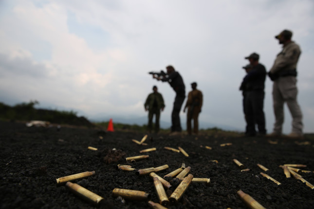 bullets on ground with silouhettes