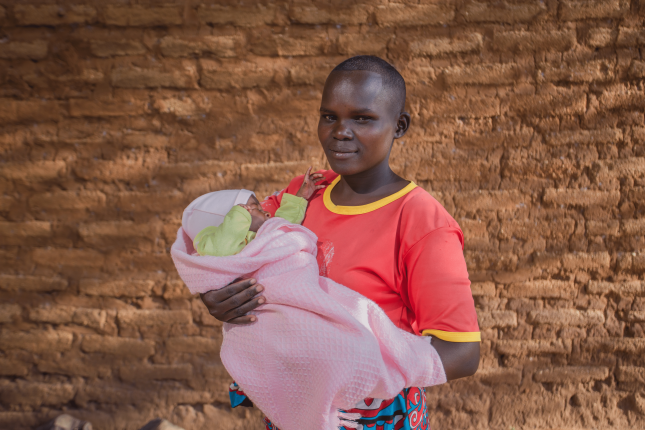 Joyce Makasi holding her baby Charity-1