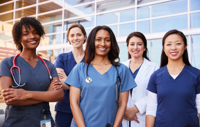 Female,Healthcare,Colleagues,Standing,Outside,Hospital