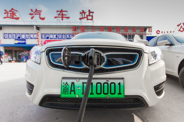 Chongqing, China - July 14, 2018: Electric vehicles are charging at the station with charging piles, in Chongqing, China