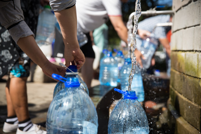 Collecting,Natural,Spring,Water,With,5,Litre,Plastic,Water,Bottle