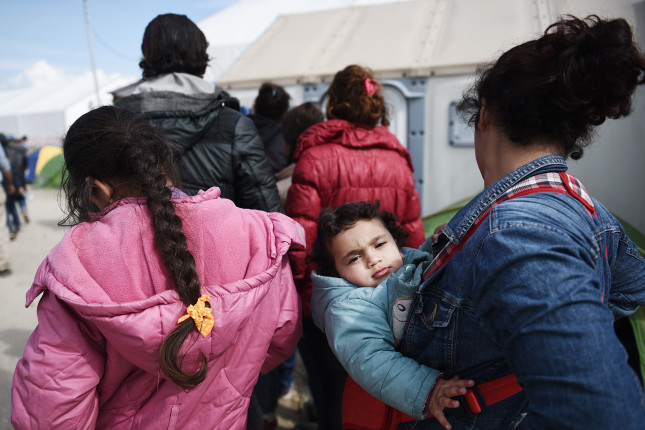 Idomeni,,Greece,-,March,2,,2016.,A,Refugee,Woman,Carries