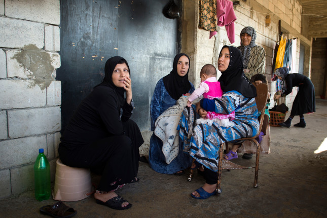 Saida-lebanon.,Women,Inside,An,Abandoned,Construction,Site,Occupied,By,Syrian