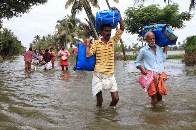 Alleppey,,India,-,Aug,26:,Unidentified,People,Walk,Through,The
