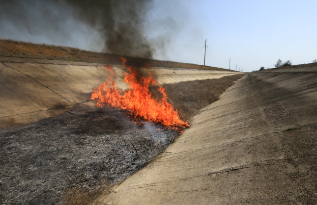 Dry,Grass,Burns,In,The,Channel,Of,The,Unused,North