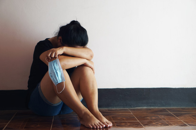 Depressed,Sad,Girl,Sits,On,The,Floor.,Hug,Her,Knees
