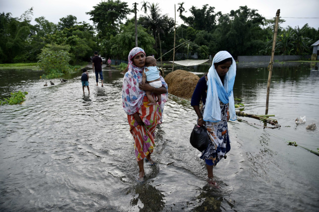 Barpeta,,Assam,,India.,July,12,,2019.,People,Wade,Through,Flooded