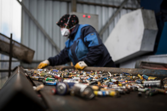 A,Woman,Worker,Is,Working,On,Used,Batteries,That,Are