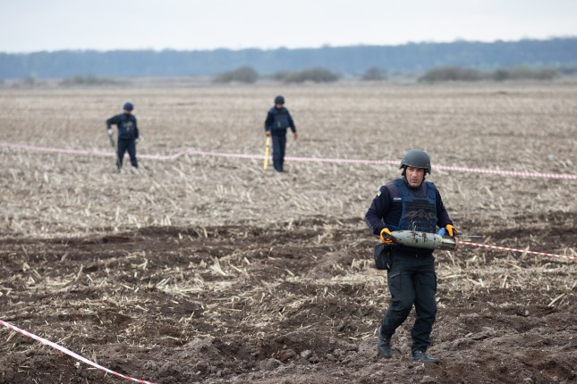 Ukrainian,Rescuers,Clear,Mines,At,The,Site,Of,Recent,Fighting